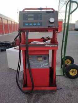 Snap - on battery tester and charger