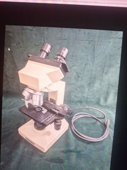 an Olympus chk 10x/18l microscope requiring a 100-120v 50-60hz compatible model  #ch-Bl45-t's, powers up