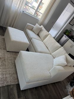 Brand new in stock cream sectionals with free ottoman