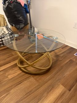 Glass and gold coffee table