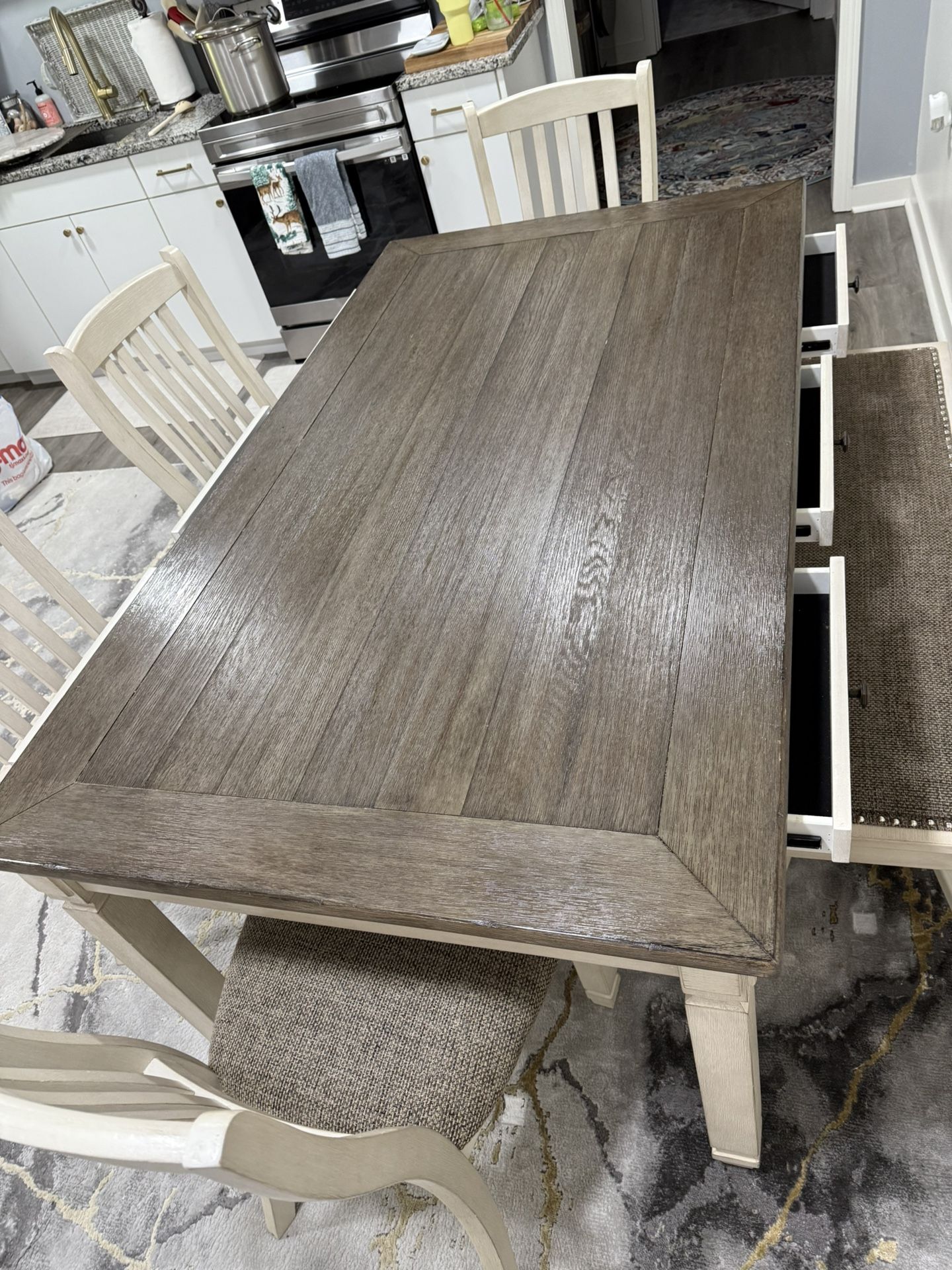 Kitchen/dining room table with four chairs in a bench