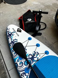Inflatable stand-up paddleboard with pump