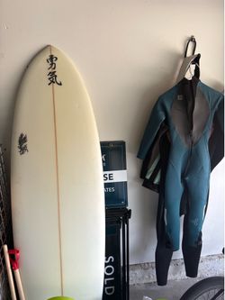 Surfboard And Wetsuit