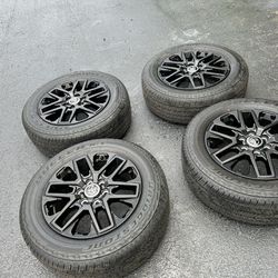 Toyota Sequoia Tundra 20 inch wheels and tires. OEM black finish. Like new Bridgestone 265/60R20 