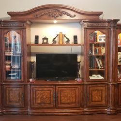 Elegant Versatile Entertainment Center With Thick Glass Shelving, Lighting Throughout And Removable Ends That Can Be Set Apart In Corners