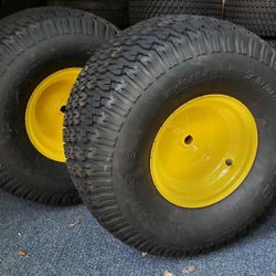 Pair of 20x10-8 Carlilse TurfTrac R/S 2 ply lawn mower tires on JD yellow wheel