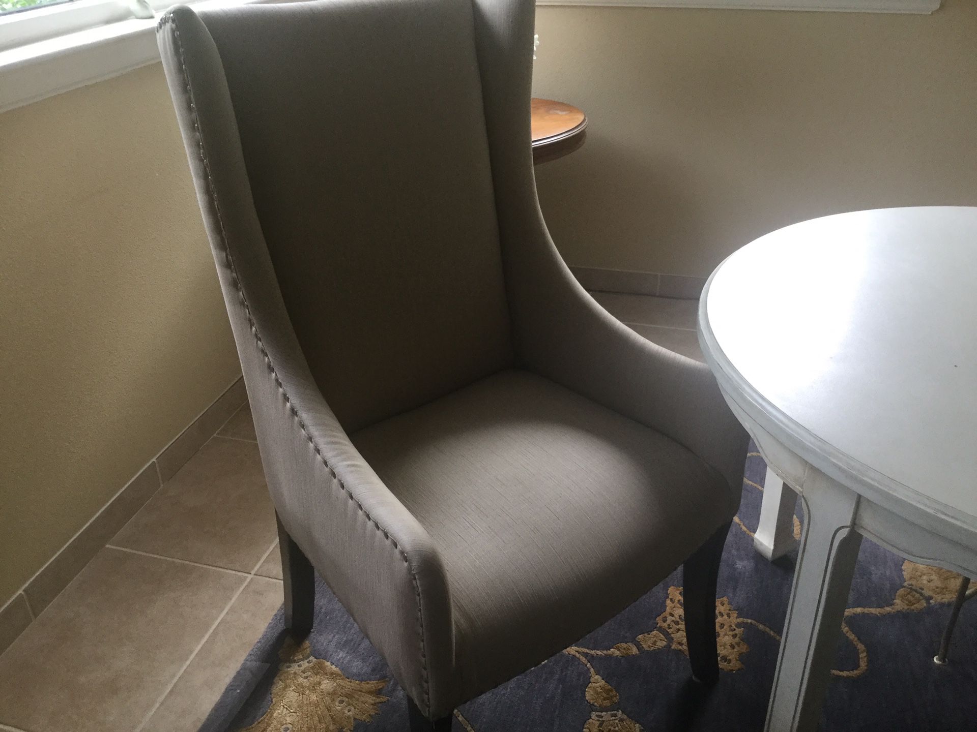 Two Beige Wingback Chairs
