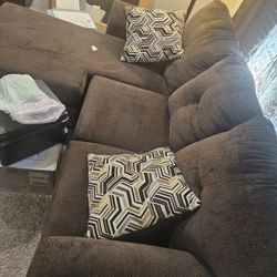 Brown Couche with 2 Pillows 