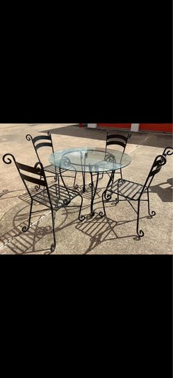 Heavy cast-iron dining table with chairs