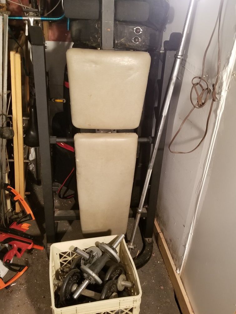 Bench press / leg extension attachment and approx. 200 lbs of weight.
