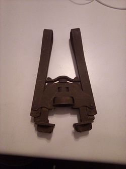 Antique Cast Iron Bottle Caper