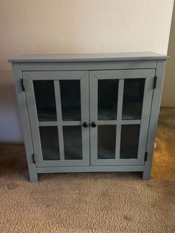 Blue-Gray Wood Cabinet with Glass Doors