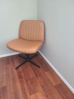 Tan swivel chair