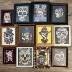 12 framed pieces of framed art featuring a Day of the Dead (Día de los Muertos) style sugar skull. 