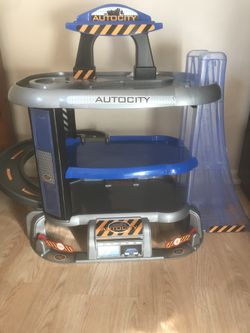 garage toy includes signs