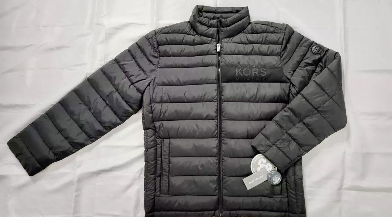 STAND NECK LONG SLEEVE WITH INNER ELASTIC CUFFS ROUND "MK" LOGO AT LEFT LONG SLEEVE FRONT CENTER FULL LENGTH ZIPPER CLOSURE RUBBER "KORS MICHAEL KORS"