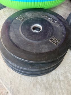Four 10lb bumper plates
