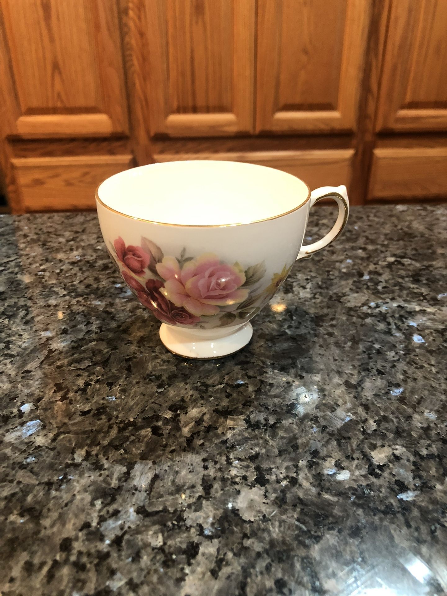  Vintage Queen Anne 8517 Floral Design  Fine Bone ChinaTea Cup .  Made in England.  Purchased in England on Vacation.  Never used.  Preowned excellent