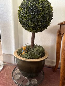 Fake plant with mini decorations