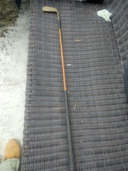Vintage wood and bronze golf club use