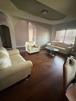 Cream couch set with( FREE decor pieces and tv stand )