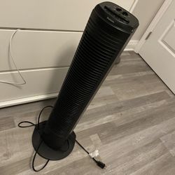 black tower fan with different modes of speed and rotation 