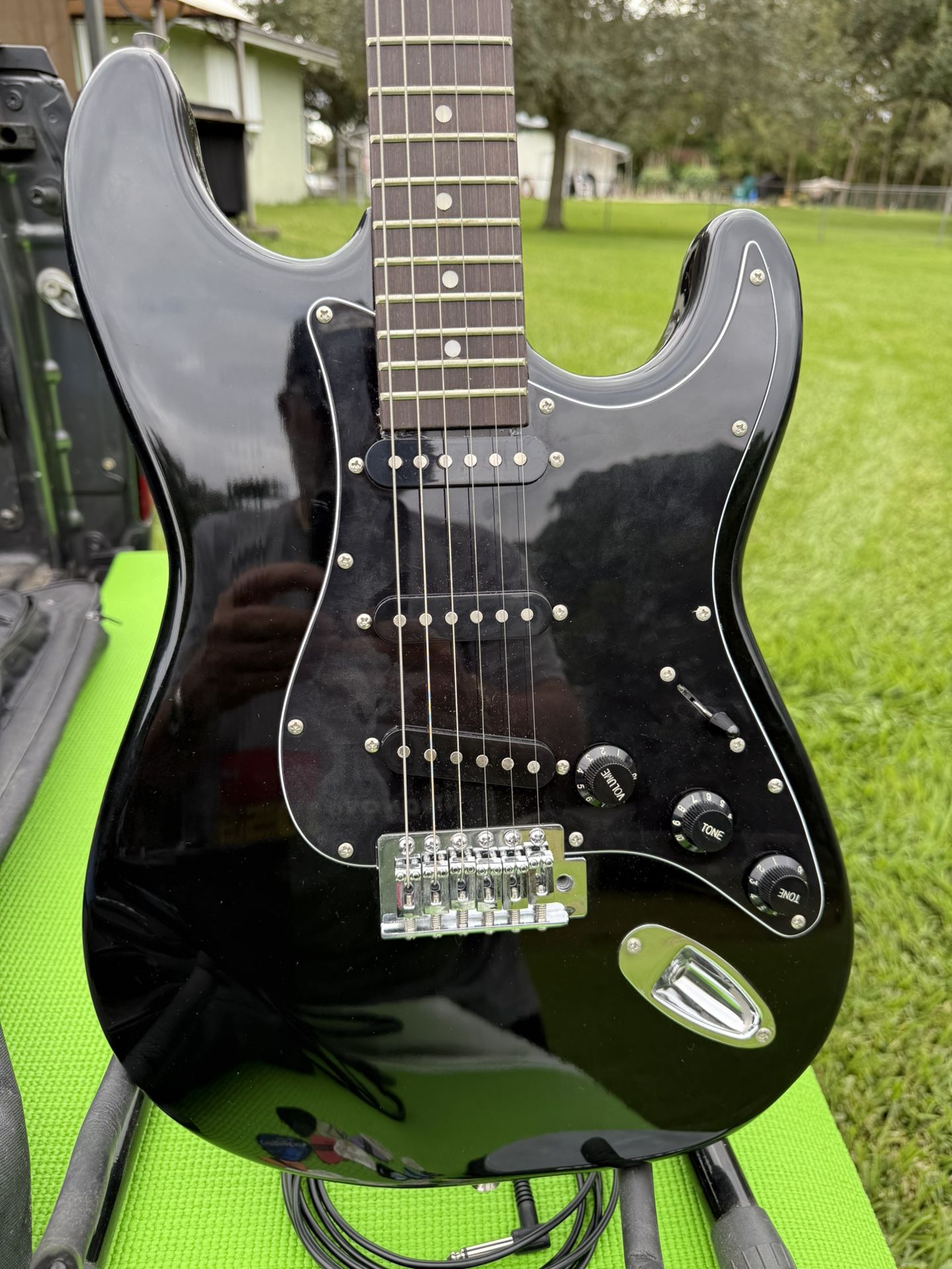 Electric Guitar With Amp, Case, Stand, And Lots Of Picks