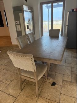 Four piece table set with a bench