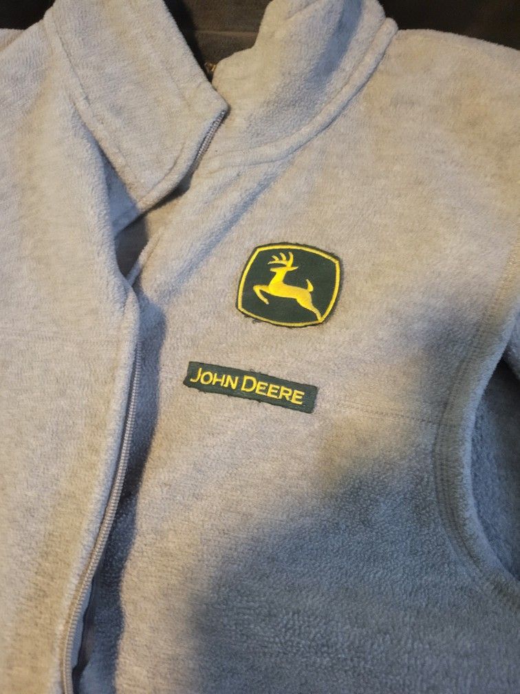 John Deere vest and long sleeve T-shirt.