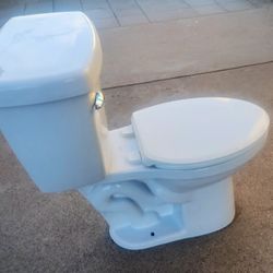 2 Delta Toilets Like New