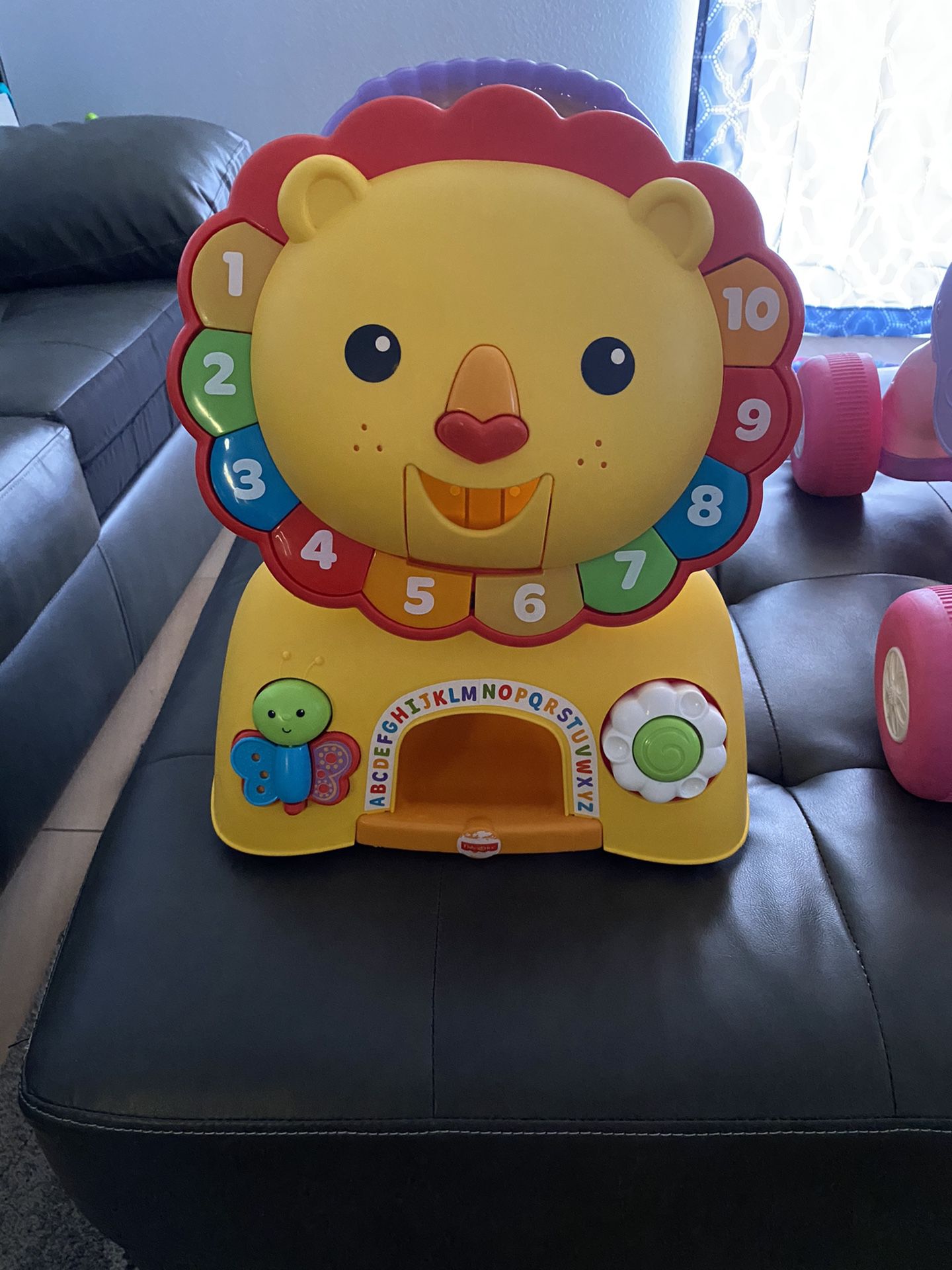 Fisher price lion ride on