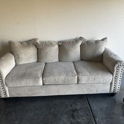 Beige Couch With 2 End Tables 