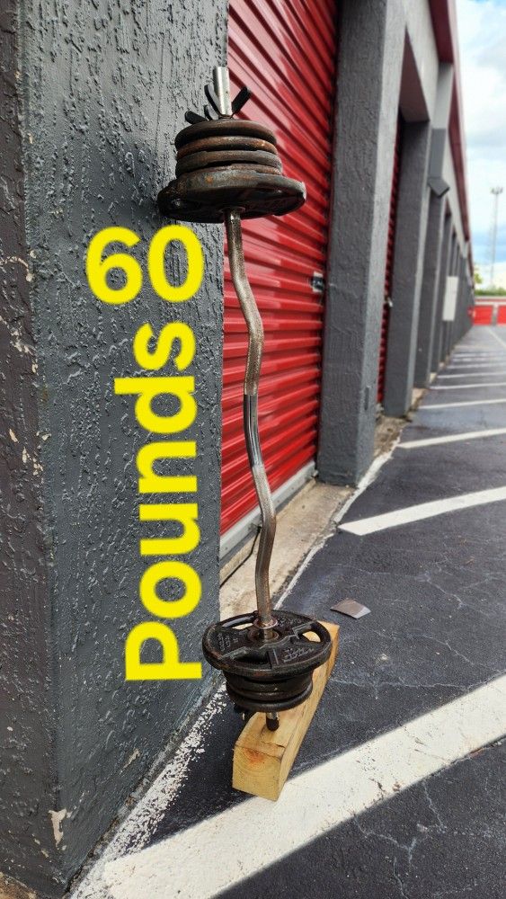 $100 Used Weight Plates 100POUNDS + used Curl Bar. Delivery fee