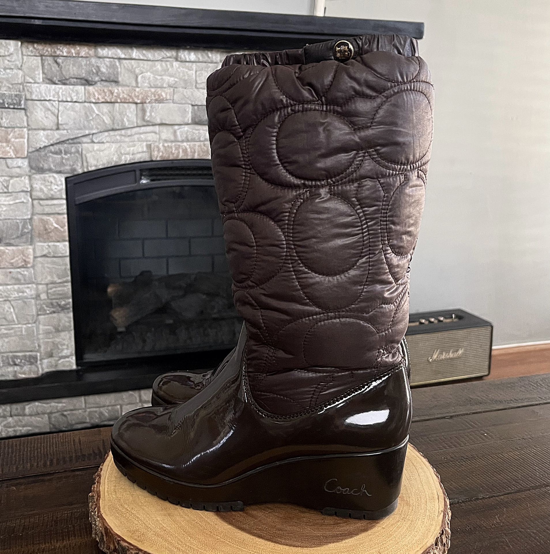 Women’s Coach Cantina A7368 wedge puffer Monogram boots. Size 8 Retail $240. Style# F2369. Great condition! Color brown with signature Coach on heel.