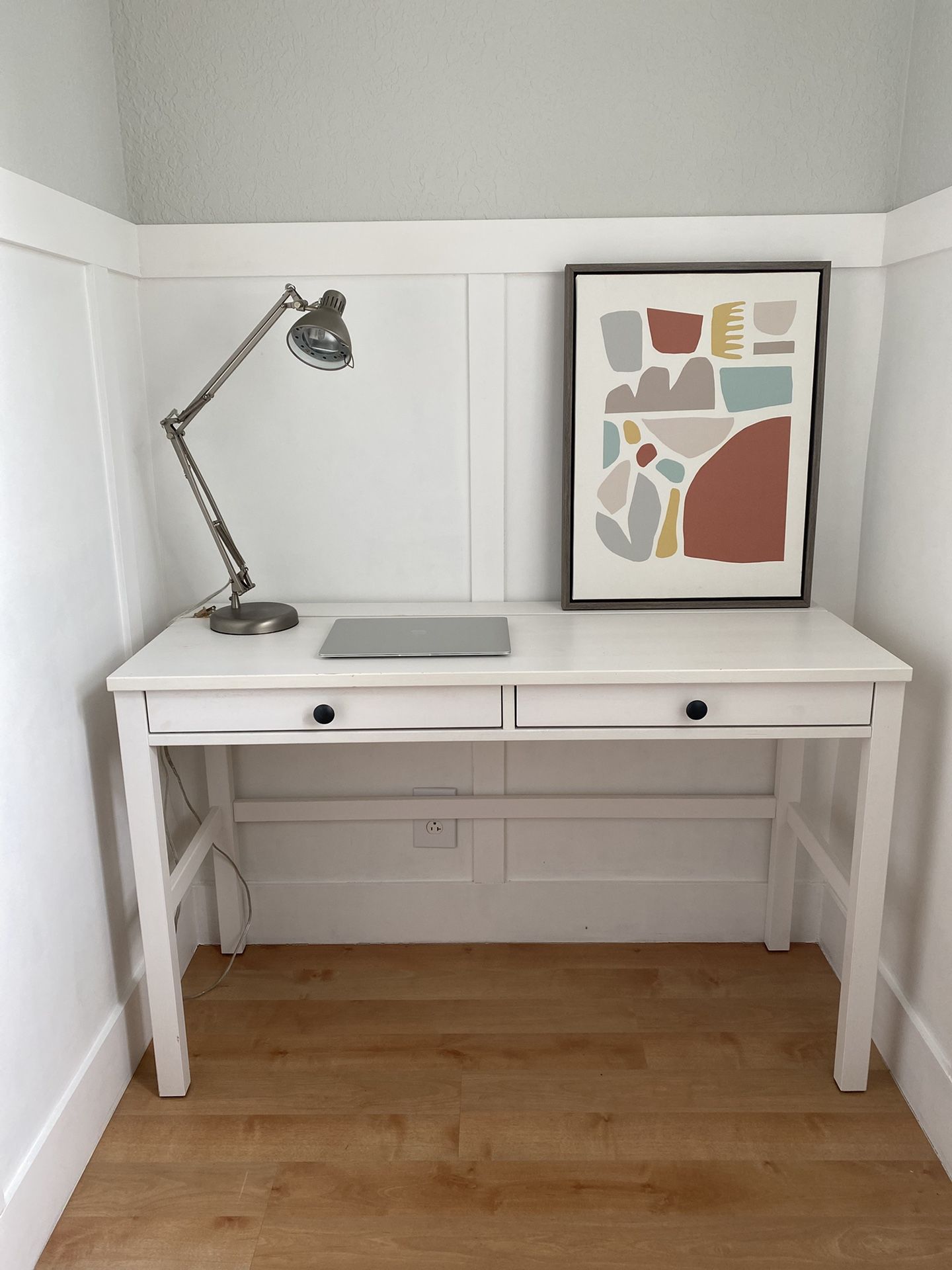 Pre-owned Ikea white Hemnes desk with two drawers and opening for cord storage.