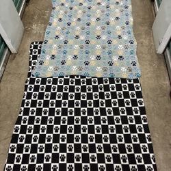 Duo Of Paw Print Fleece Blankets