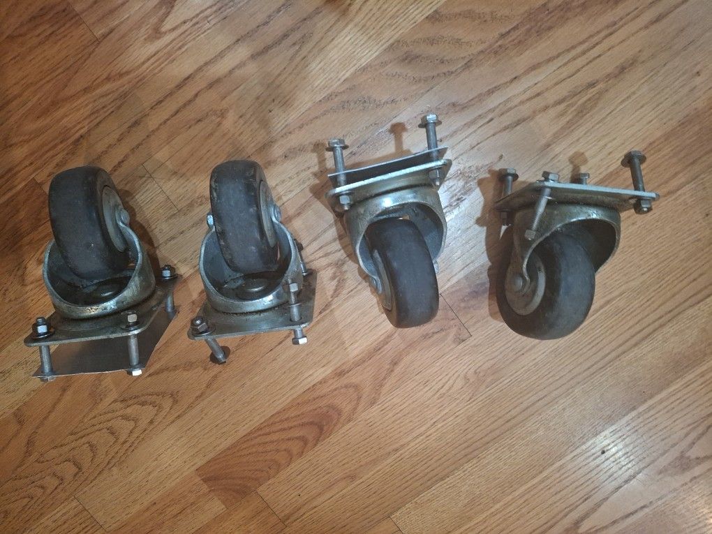 Pack of 4 Swivel 4 inch d x 2 in w Polymer Caster Wheels with nuts