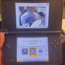 Nintendo DSI XL + Games