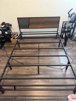 Metal bed frame with head rest