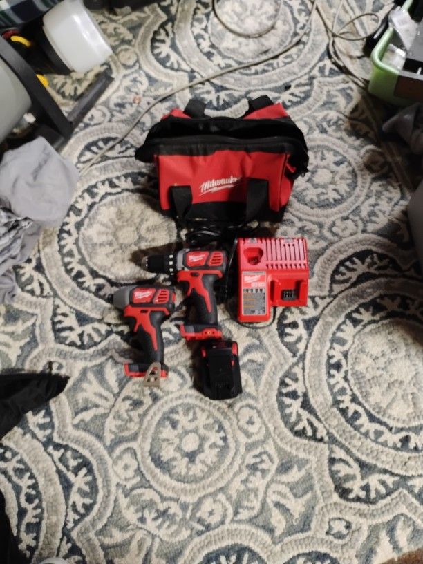 Milwaukee Impact Driver And Drill Kit With Battery Charger And Bag