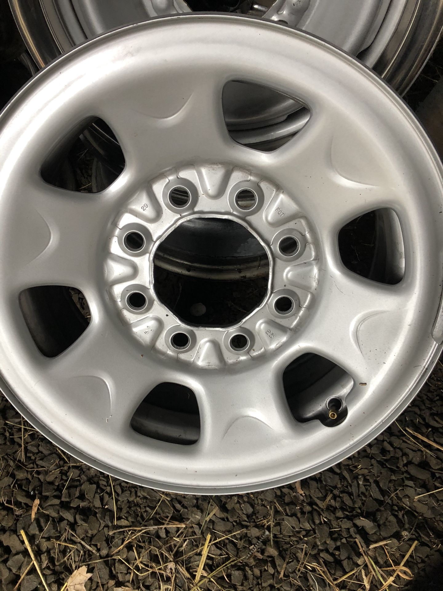 2 sets of 16” GM wheels (8) with 4 Chevy center caps
