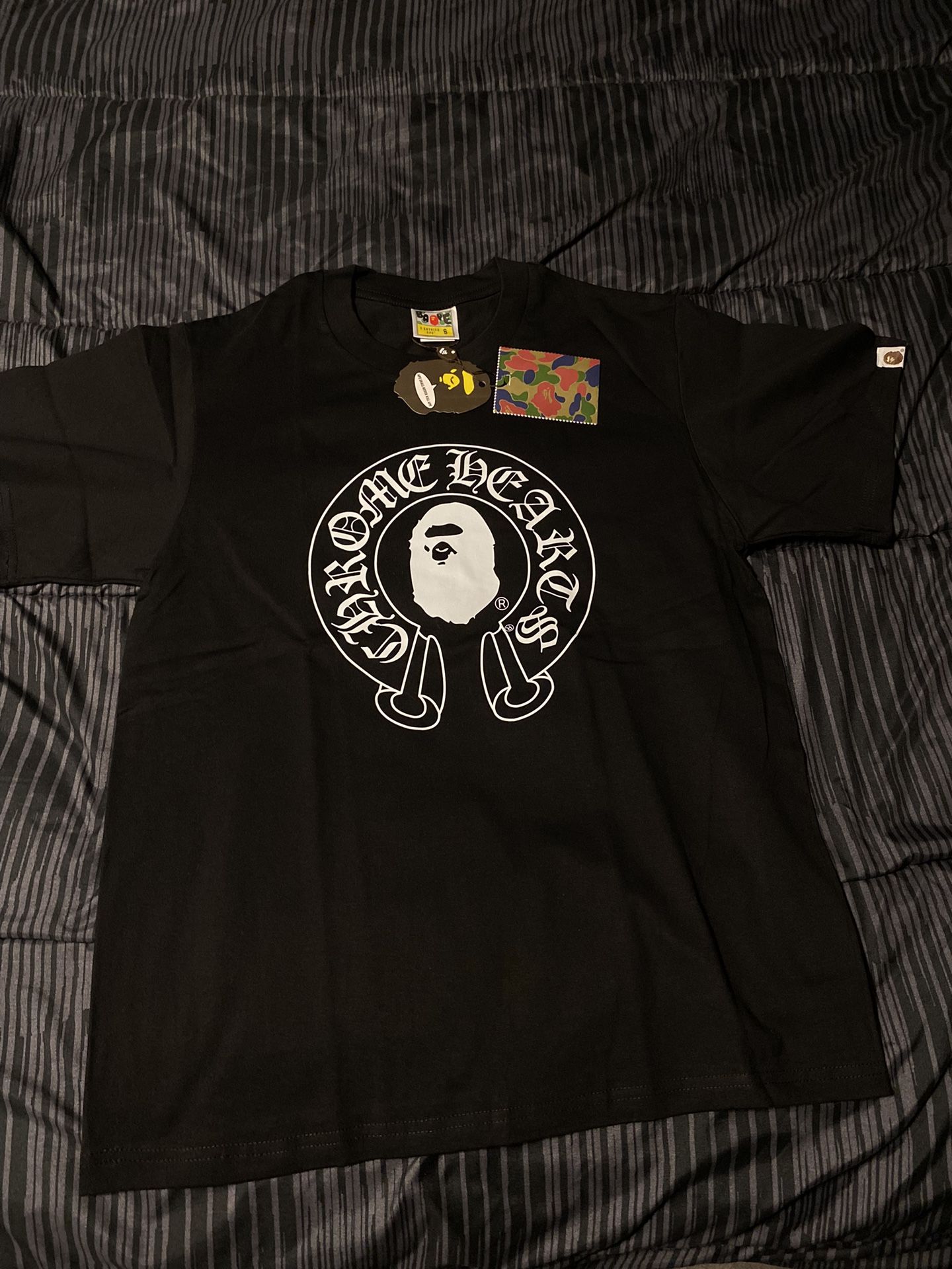 Black bape/chrome hearts shirt.