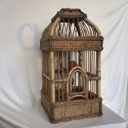 Decorative bamboo birdcage with hand carved and fabricated birds.