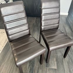 Two dark brown chairs