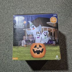 Inflatable Halloween ghosts coming out of a pumpkin