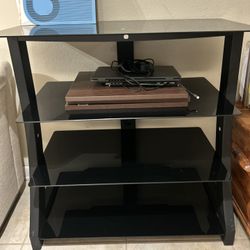 black glass and metal TV/media stand 