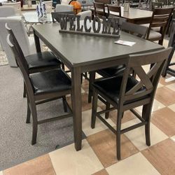 CAITBROOK COUNTER HEIGHT DINING TABLE AND BAR STOOLS (SET OF 7)