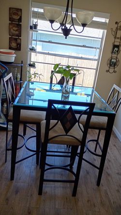 High top glass table and 4 chairs