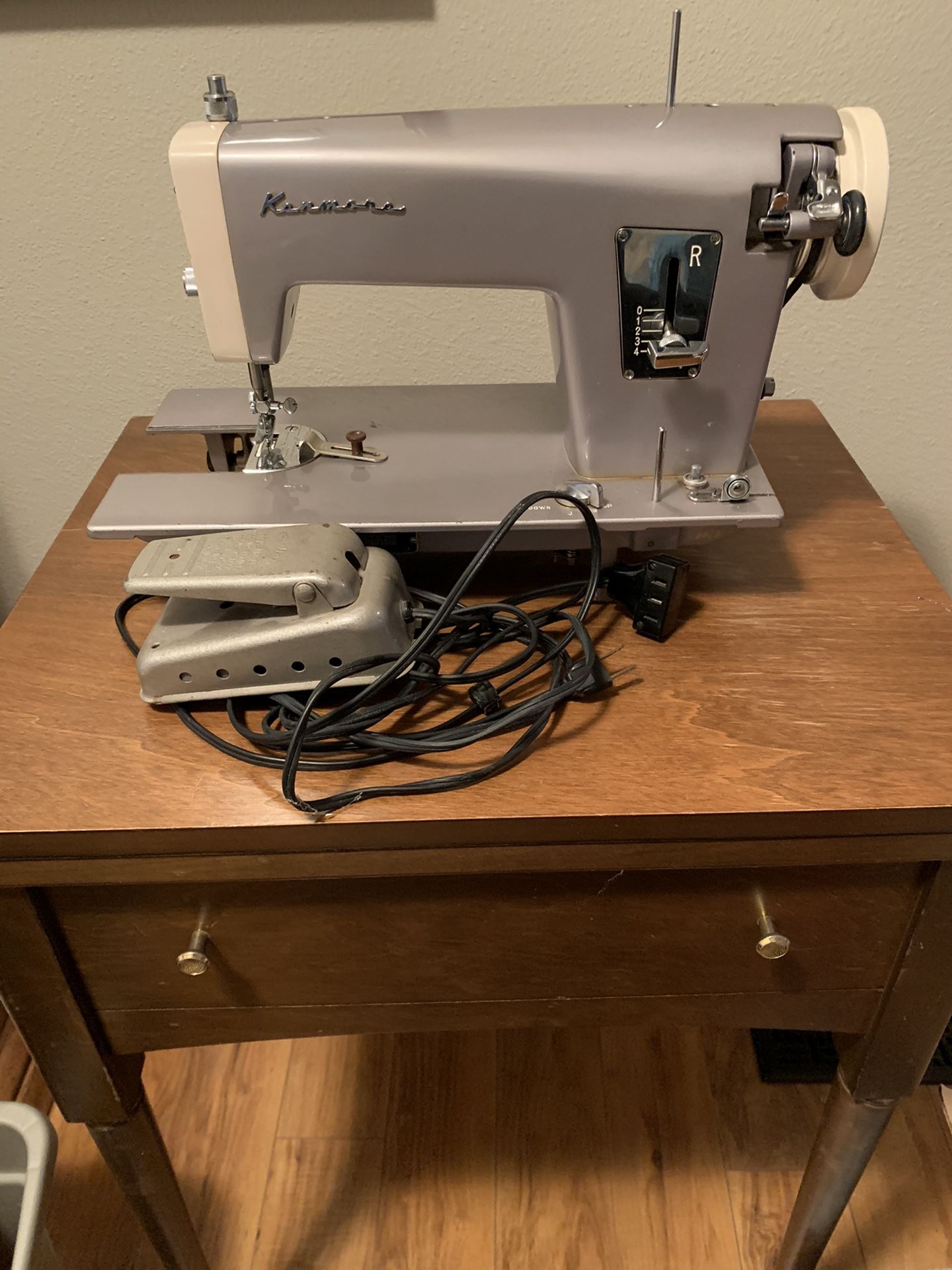 Vintage Kenmore sewing machine with stand