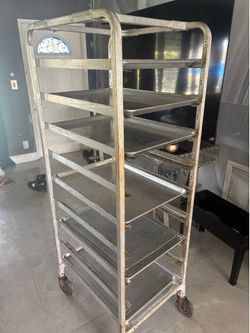 Restaurant and/or Bakery  Rack on wheels and  6 large 24” trays and 4 grates